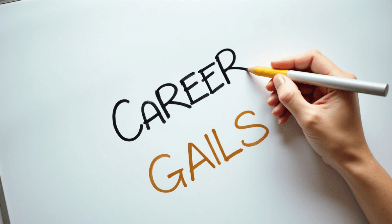 Hand writing career goals on a white surface